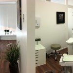 Hallway and patient room at {PRACTICE_NAME}
