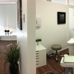 Hallway and patient room at {PRACTICE_NAME}